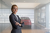 Portrait car saleswoman in showroom