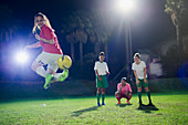 Young soccer players practicing, doing back kick