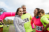 Happy family runners at charity run