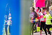 Runners cheering, running at charity run