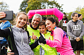 Enthusiastic family runners taking selfie