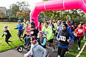 Runners running at charity run in park