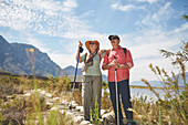 Active senior couple hiking with hiking poles