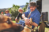 Active senior man petting dog