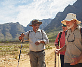 Active senior men friends hiking