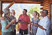 Active senior friends drinking wine