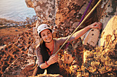 Portrait smiling, confident female rock climber