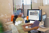Female designer working at computer in office