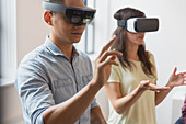 Computer programmers testing VR simulator glasses
