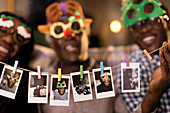 Family in goggles showing instant photos