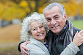Portrait smiling, confident senior couple hugging