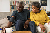 Senior couple checking blood pressure