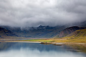 Clouds over remote landscape and water, Iceland