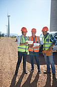 Engineer and workers using digital tablet