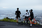 Male cyclist friends taking a break