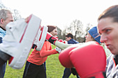 People boxing in park