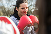 Determined woman boxing