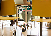 Legs of businesswoman under conference room table
