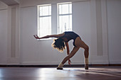Graceful, flexibility young female dancer practicing