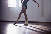 Graceful young female dancer practicing