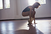 Strong young female dancer stretching toes