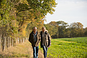Mature couple walking in autumn park