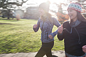 Smiling female runners running