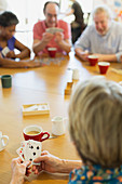 Senior friends playing cards