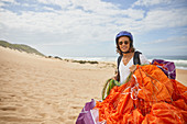 Portrait male paraglider with parachute