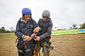 Paragliders preparing equipment