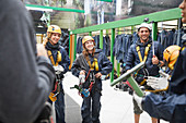 Friends preparing zip line equipment