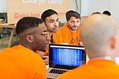 Dedicated hackers coding for charity at hackathon