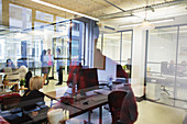 Business people in open plan office