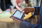 Close up businessman using digital tablet