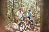 Father and daughter mountain biking