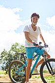 Portrait smiling, mature man mountain biking