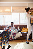 Playful multi-ethnic family in pyjamas