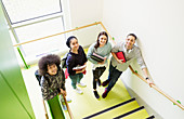 Portrait high school students on stair landing