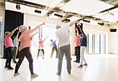 Active seniors dancing, exercising and stretching