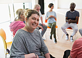 Instructor leading active senior exercise class