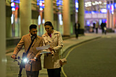 Business people walking at night