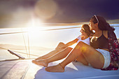 Young women relaxing on sunny boat
