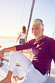 Portrait man relaxing on sunny boat