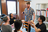 Creative business people enjoying coffee and tea