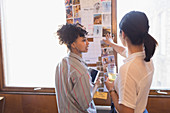 Creative female designers reviewing photographs