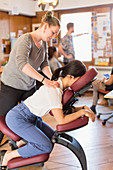 Creative businesswoman receiving massage