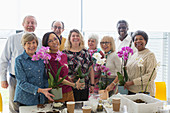 Portrait Seniors enjoying flower arranging class