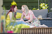 Affectionate lesbian couple relaxing on patio