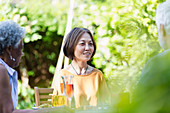 Senior friends enjoying garden party