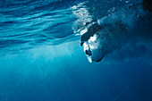 Propeller underwater in blue ocean